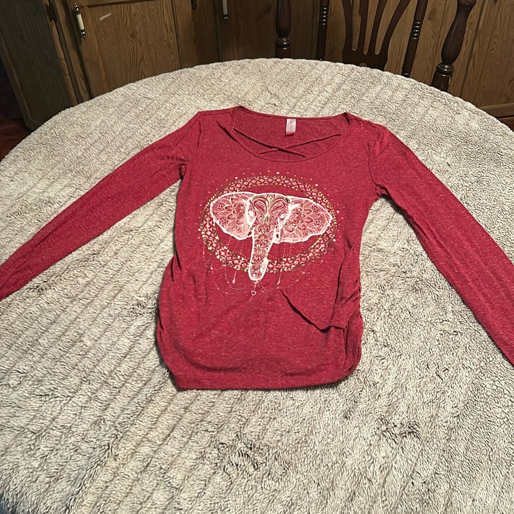 Light reddish, maroon, long, sleeved shirt with a crisscross neck size Large
